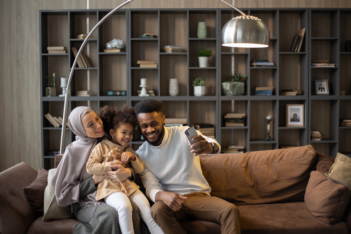 A family relaxing comfortably in their home